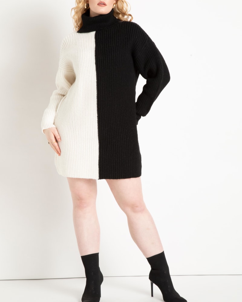 Front of a model wearing a size 14/16 Tay Turtle Neck Tunic Sweater Dress in Totally Black/Soft White by ELOQUII. | dia_product_style_image_id:236420